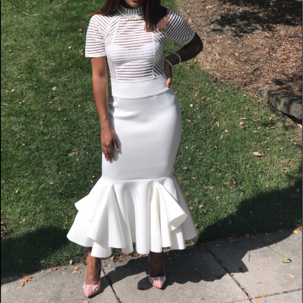 White dress w/ ruffled bottom and mesh top.
